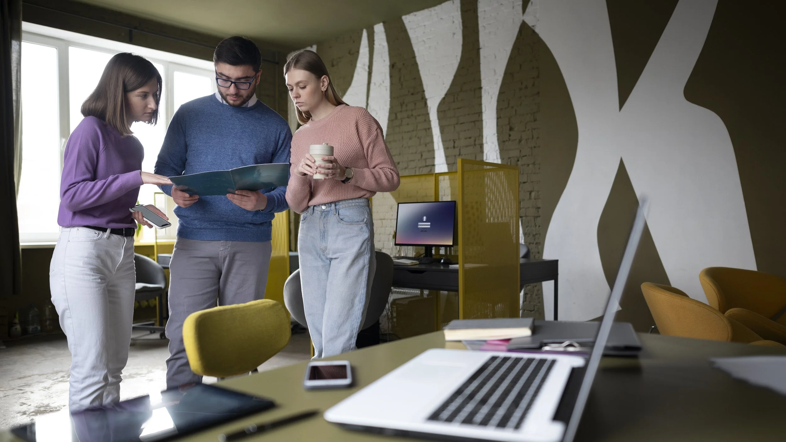 A team collaborating in a modern coworking space